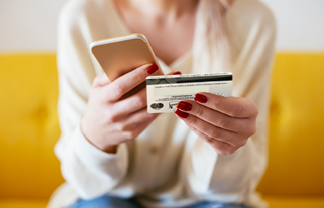 Person Adding Debit Card to Mobile App
