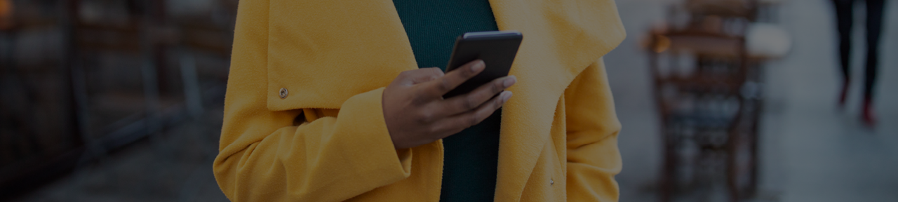 Person in Yellow Coat Sending Interac e-Transfer.png