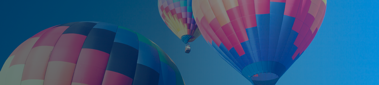 Three Colourful Hot Air Balloons in Sky