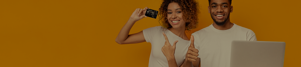 Two People Smiling While Holding Creative Arts Financial Debit Card