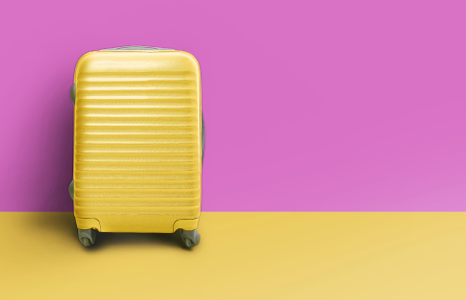 Yellow Suitcase in front of Fuchsia Wall.png
