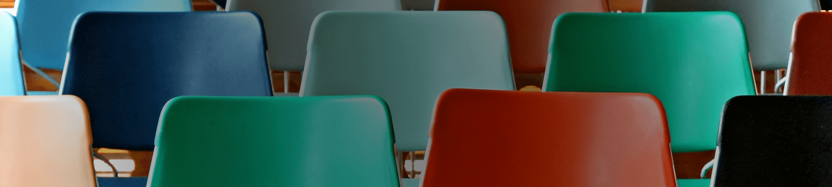 Several Colorful Chairs Arranged in Rows