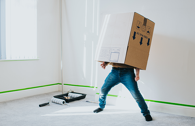 Person With Moving Box on Head