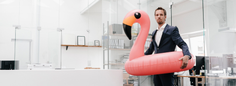 Man with Flamingo Inner Tube