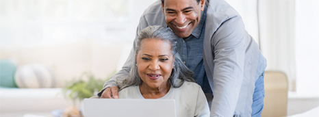 Couple looking at premium Creative Arts Financial Collabria credit cards
