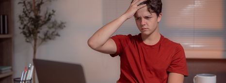 Student scratching his head after potential student loan forgiveness scam