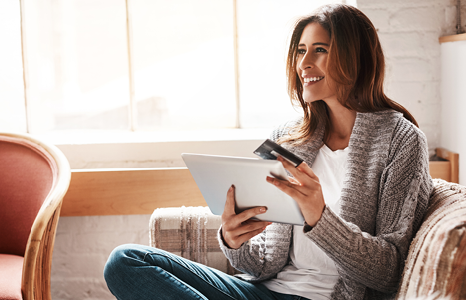 Woman Using Tablet to Initiate Balance Transfer