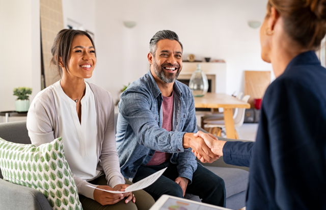 Couple Shaking Hands with Wealth Advisor